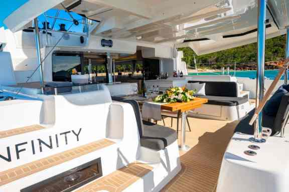 Charter Catamaran 'Infinity' Aft deck with afresco dining under hardtop