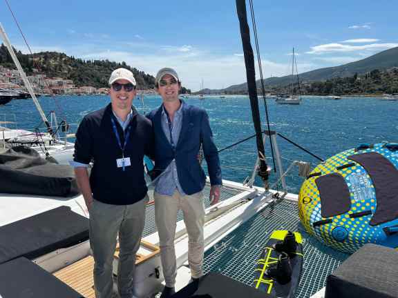 Yacht Charter Brokers Max and Miles Froelicher onboard catamaran at POROS Yacht Show 2025