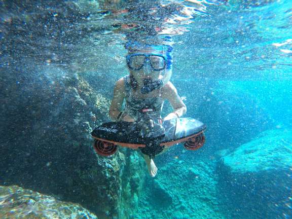 Guest using E water scooter